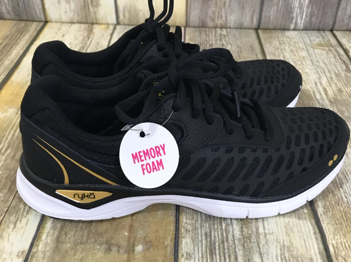 black women's shoes on wood floor