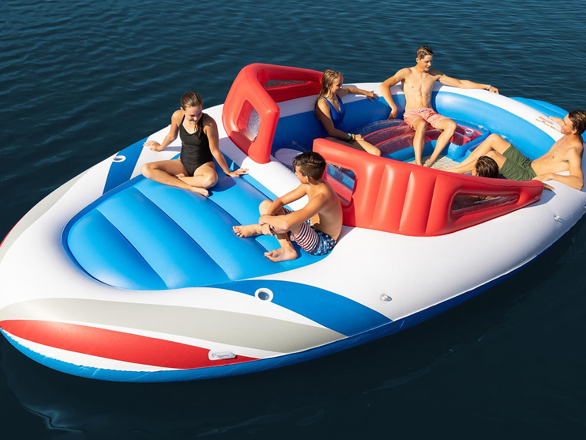 people sitting giant boat inflatable