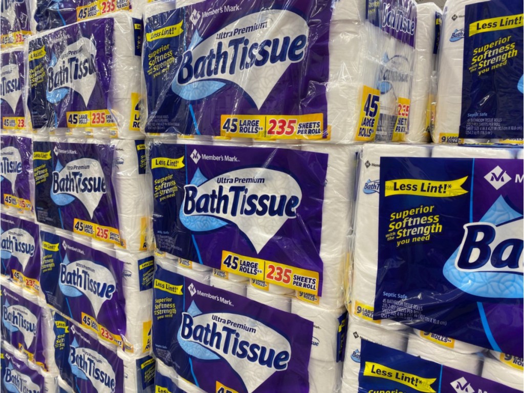 large packages of toilet paper stacked high in store