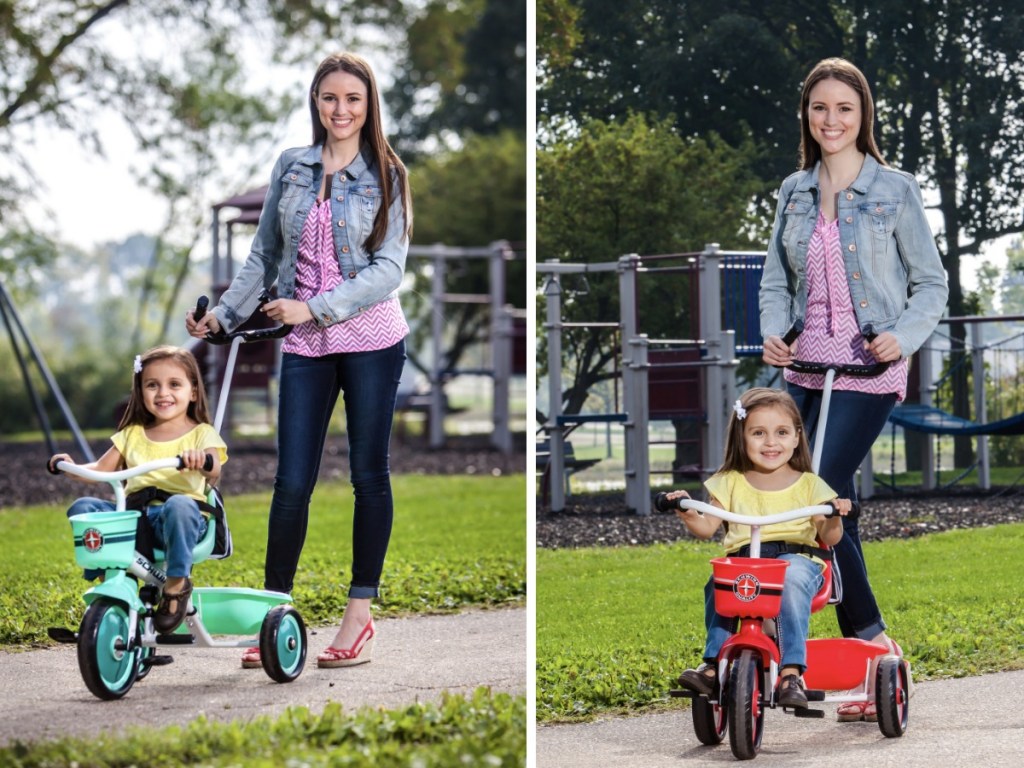 Mother pushing daughter on Schwinn Easy-Steer Tricycle