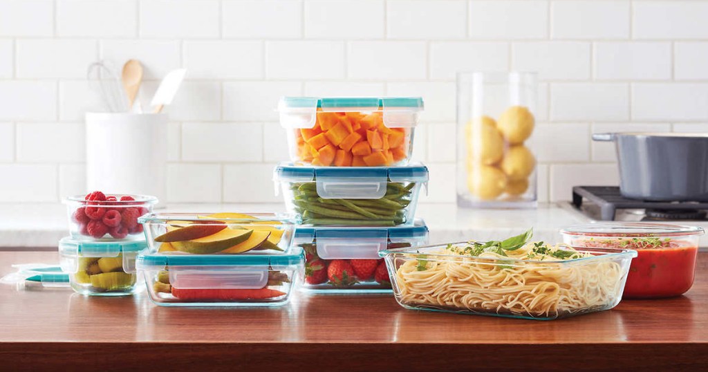 food containers filled with various foods on wood counter