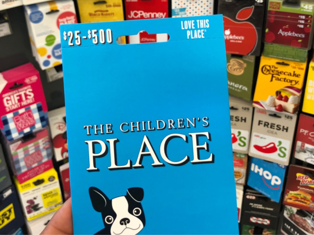 children's store gift card in front of display of gift cards