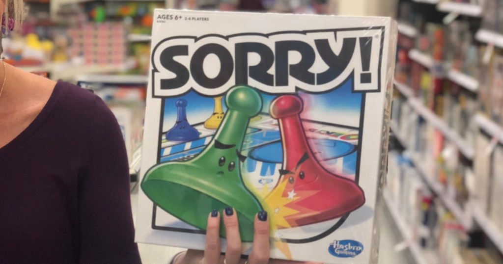 Person holding Sorry! board game