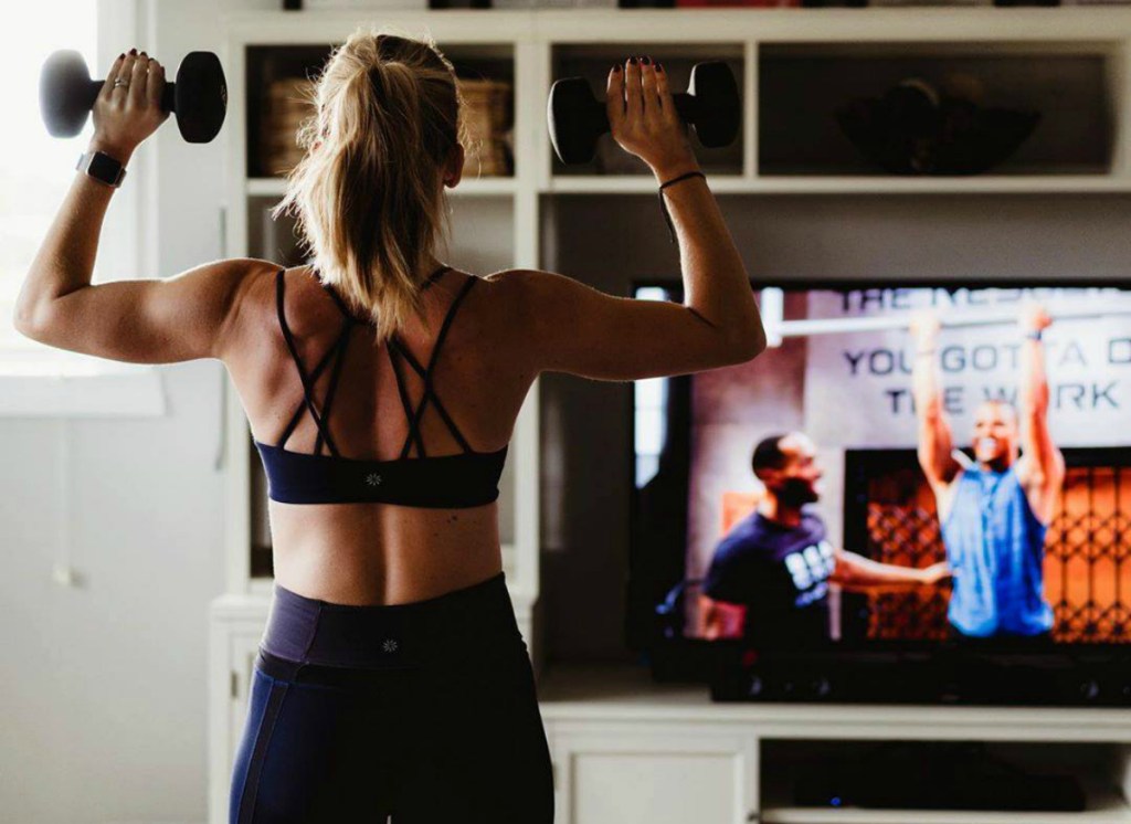 woman working out in living room