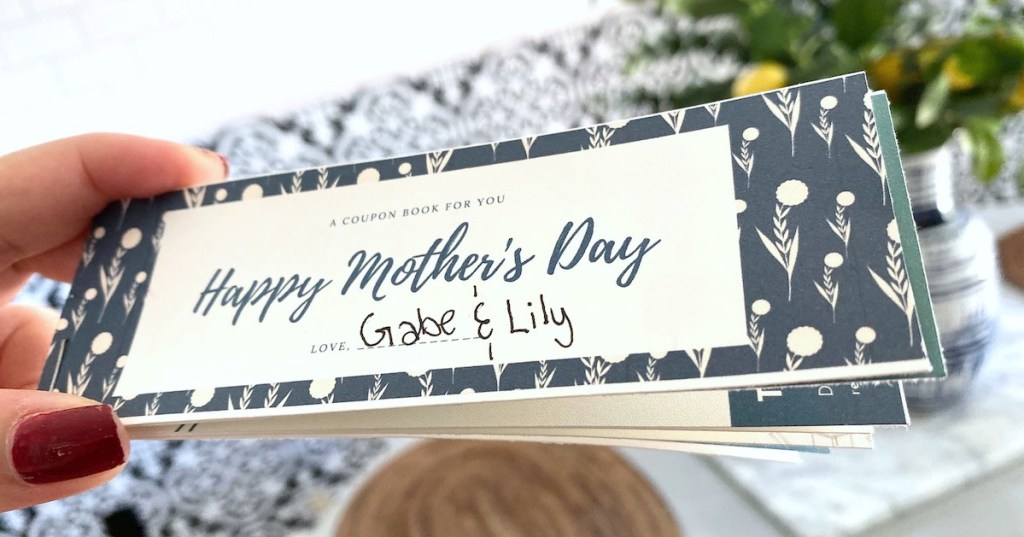 hand holding coupon book for mom mother's day gift
