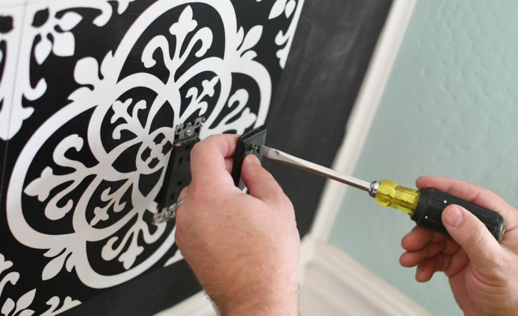 cutting vinyl tiles around electrical outlet