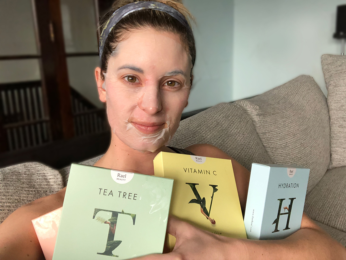 woman holding a variety of rael sheet masks