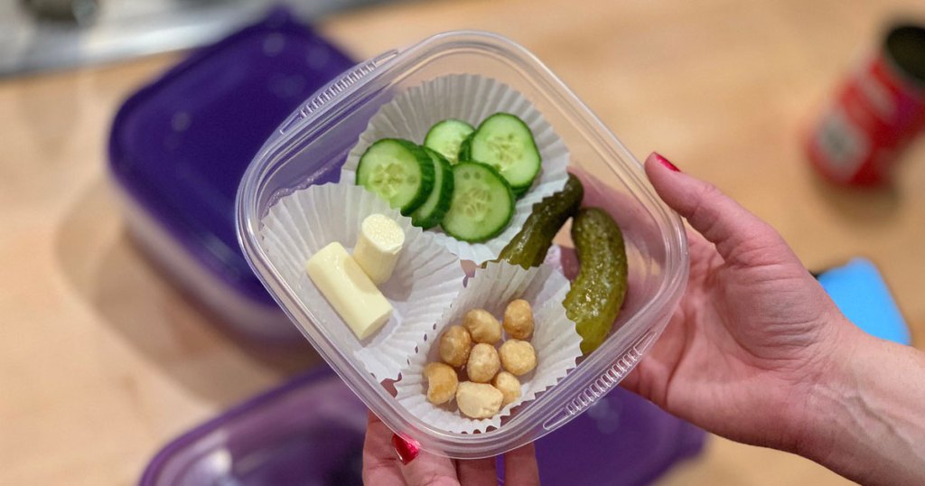 keto snack container filled with nuts, pickles, cheese and cucumbers