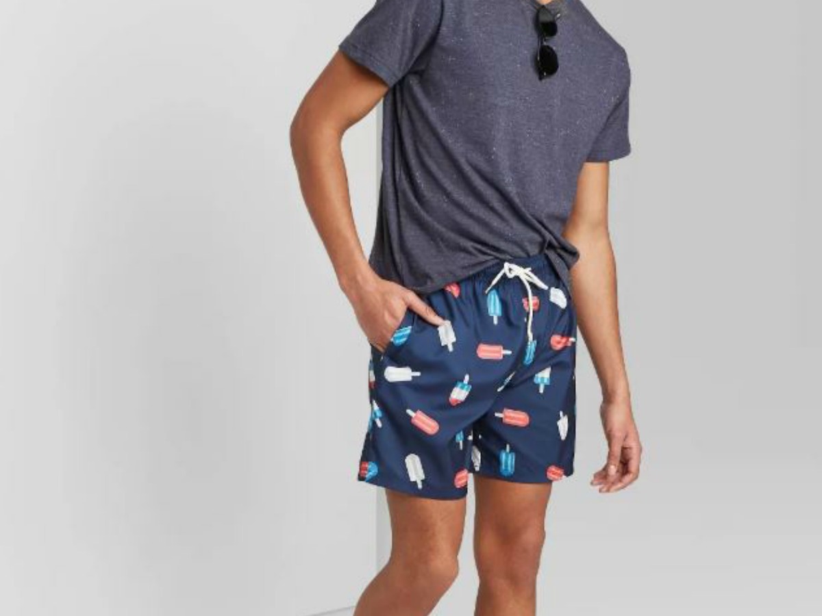 man in shorts, tee shirt and sunglasses