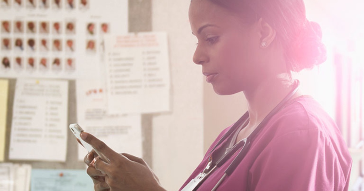 nurse looking at cell phone