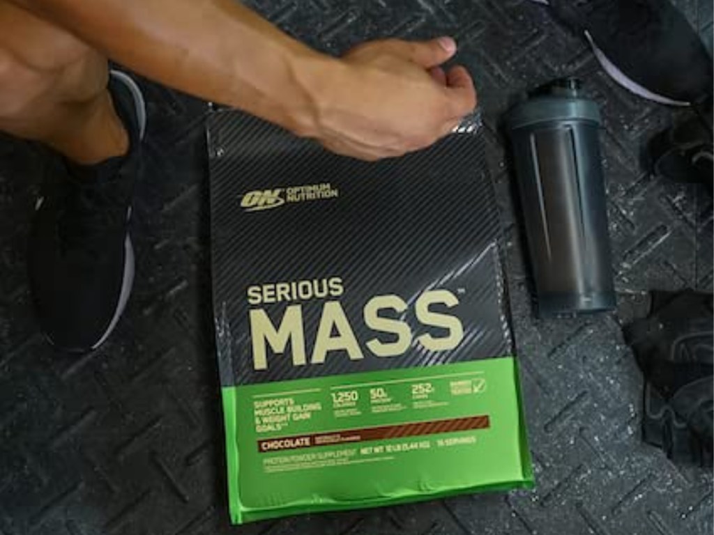 optimum nutrition serious mass package on gym floor