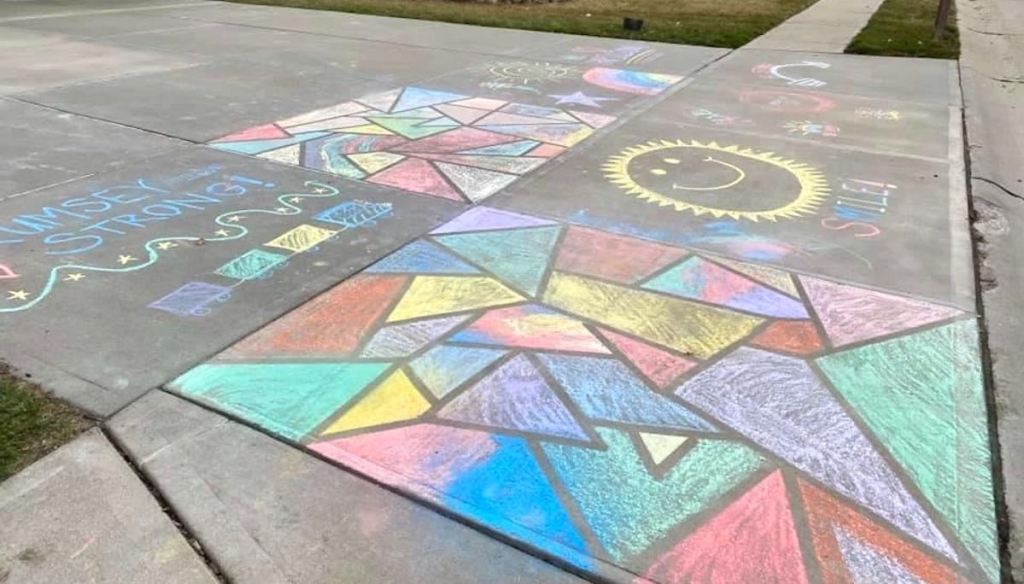 different artwork on sidewalk with chalk 