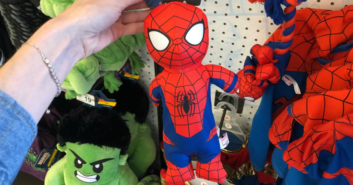 hand holding spiderman dog toy