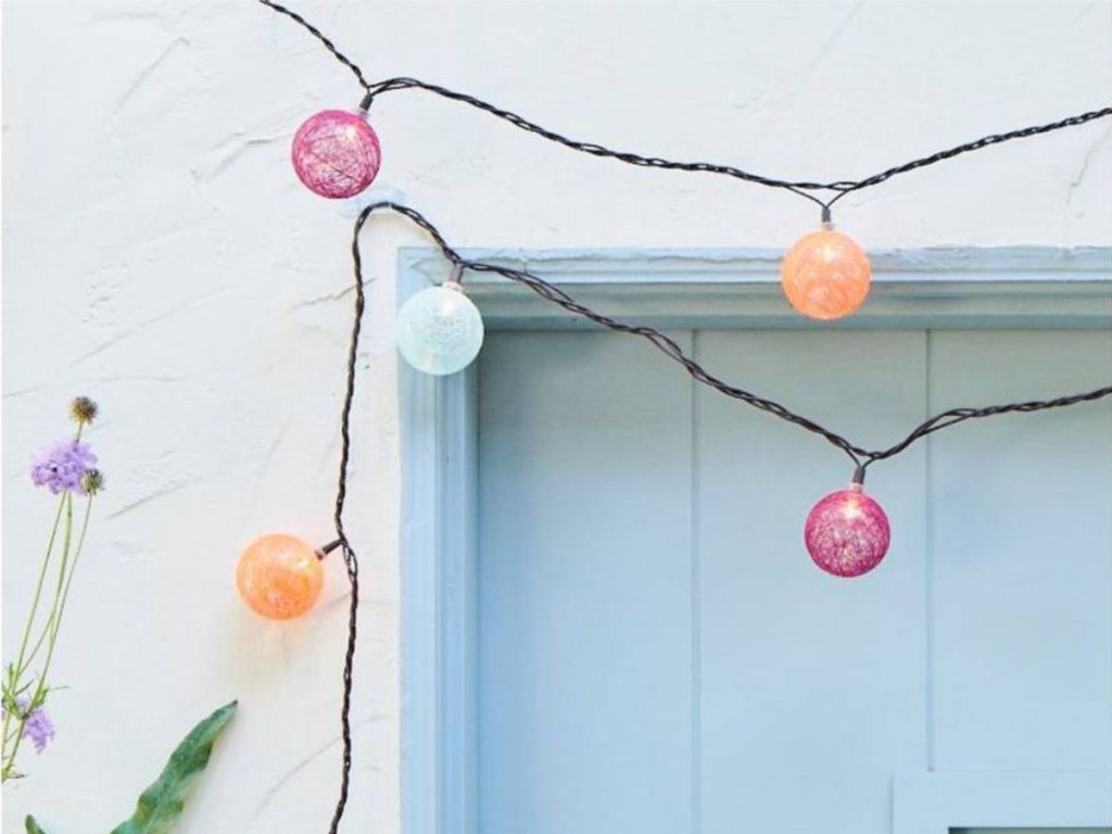 round orb lights hanging on blue door