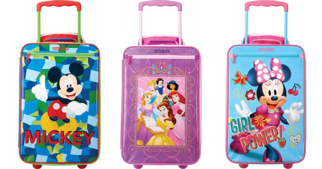 3 kids Disney suitcases lined up next to each other