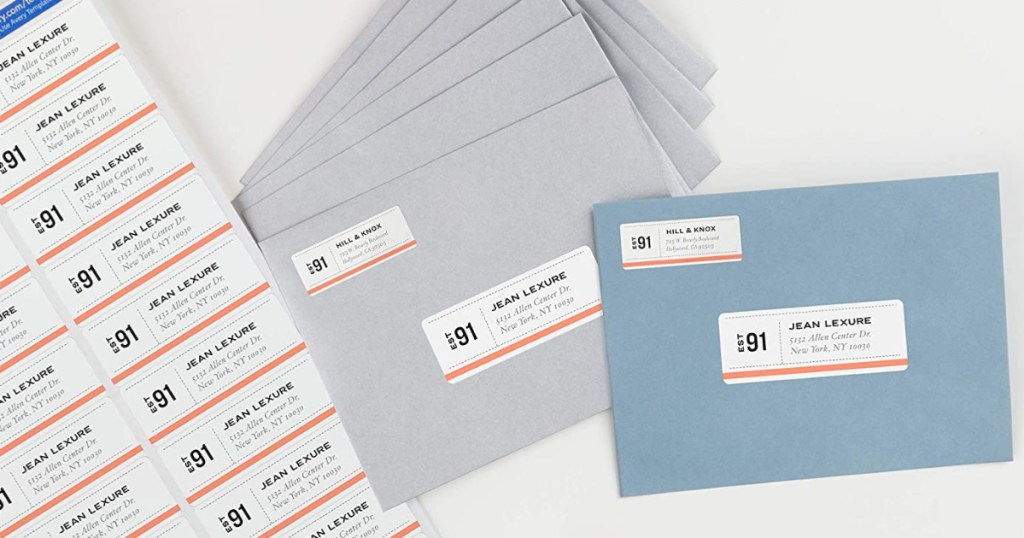 paper with address labels and grey envelopes and blue envelopes with address labels on them