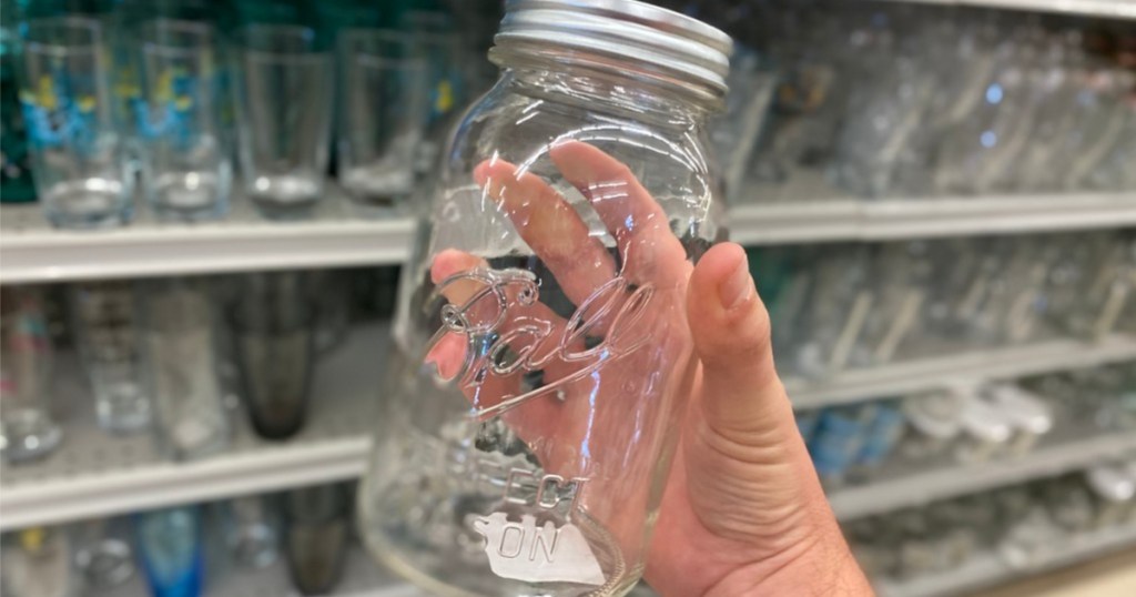 hand holding mason jar in store aisle