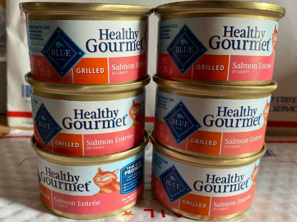 six cans of salmon cat food on shipping package
