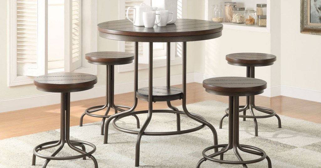 Burney 5-Piece Counter-Height Dining Set in living room with carpet underneath and coffee cups on table
