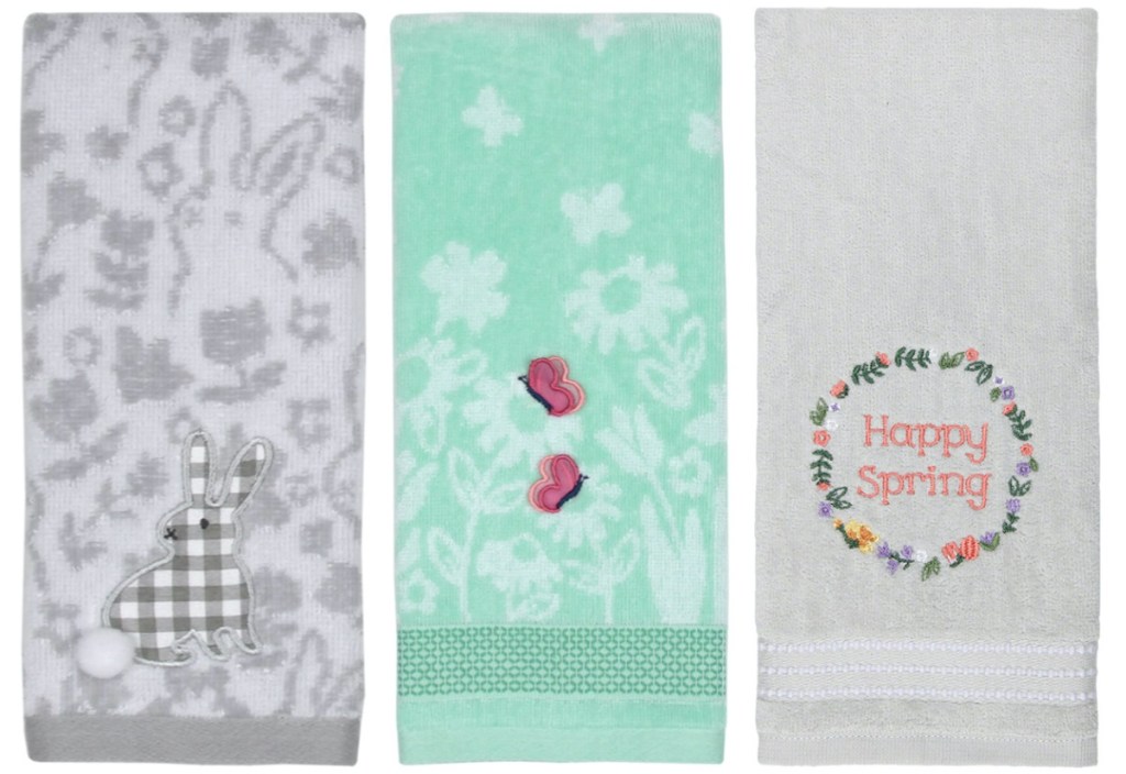 gray bunny hand towel, blue/green hand towel with pink butterfly, and gray hand towel with floral wreath that says "happy spring"