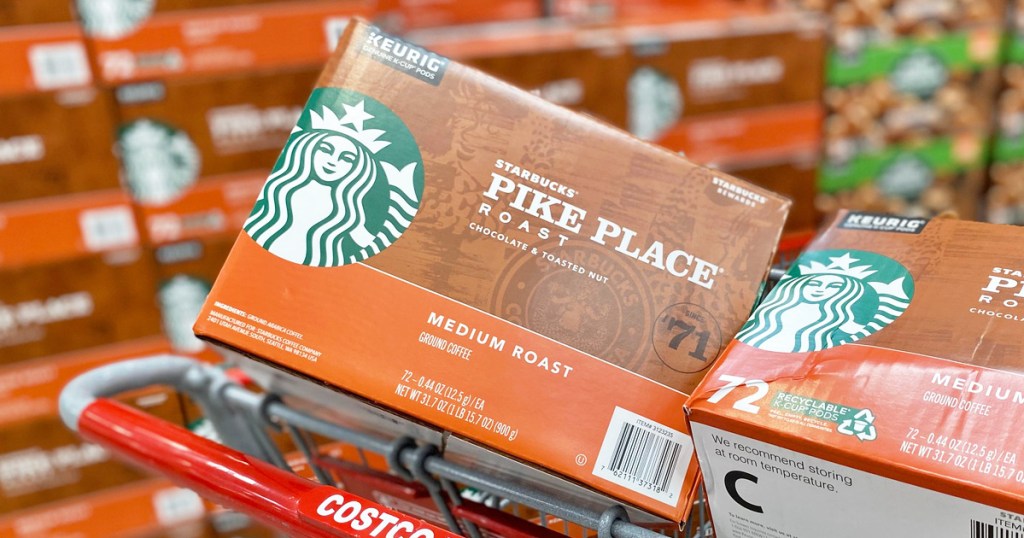 two brown and orange boxes of starbucks pike place k-cups in costco shopping cart