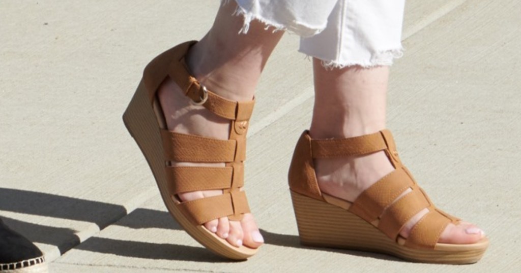 woman wearing mustard yellow color wedges