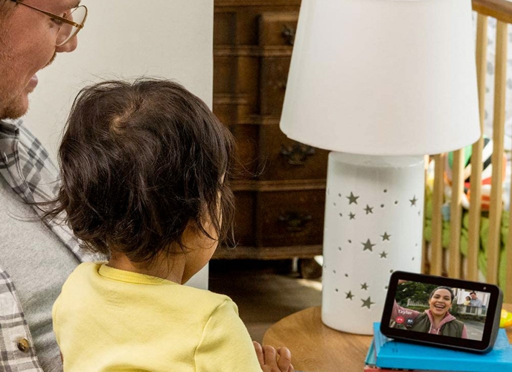 grandfather and grandchild using amazon echo show to call someone