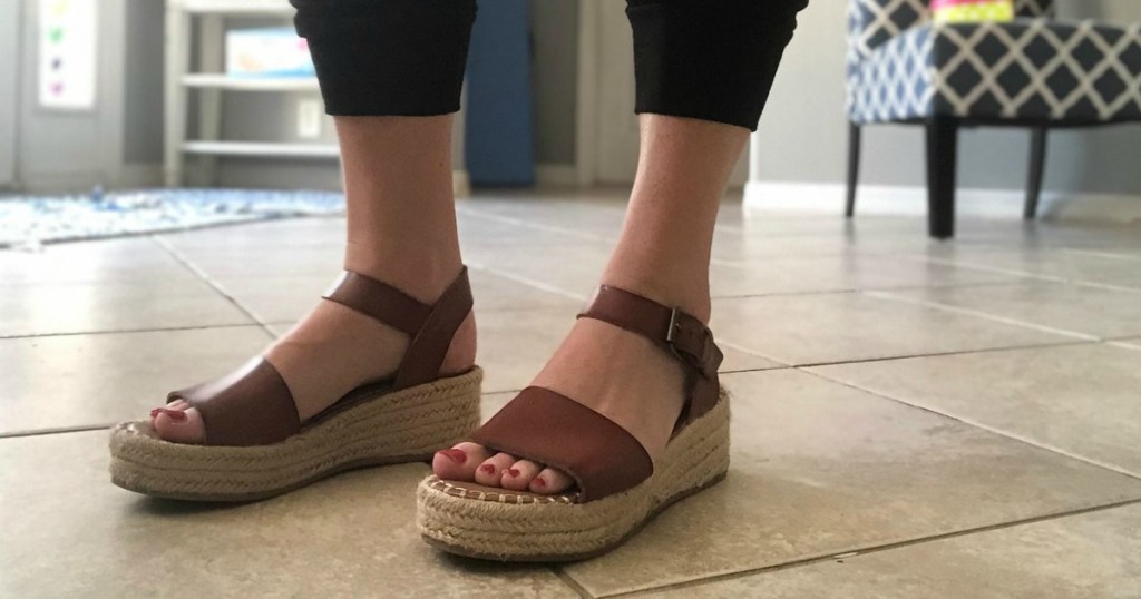 Women's wearing platform sandals with painted tonenails