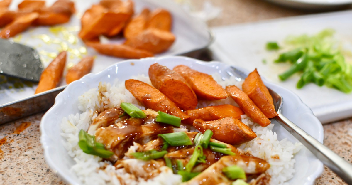 plate with carrots, rice and meat from every plate