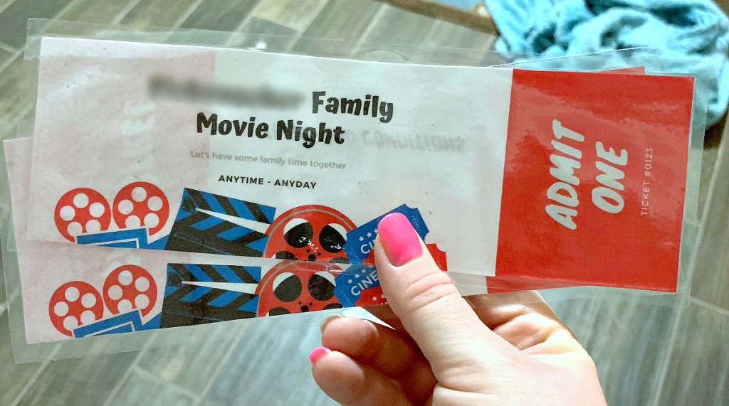 holding family movie night tickets
