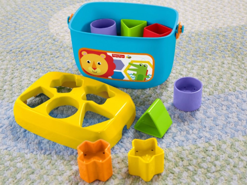toy blocks and bin on carpet