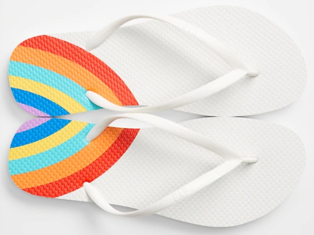 women's white flip flops with rainbows on the heels