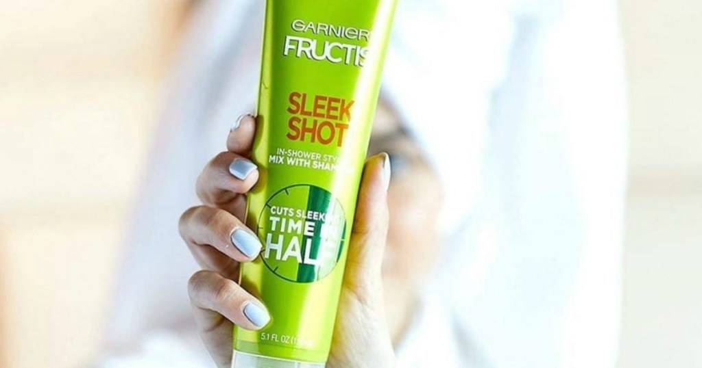 woman holding Garnier sleek shot tube