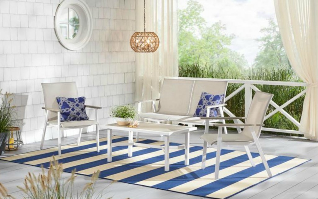 blue and white rug with patio furniture on it