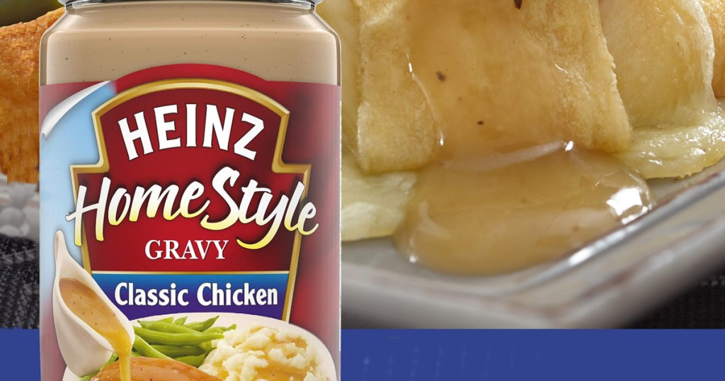 jar of heinz classic chicken gravy sitting front of dinner roll with gravy on it