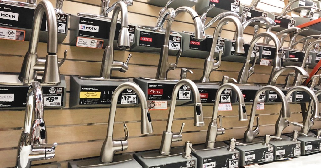 home depot store display wall of various kitchen faucets
