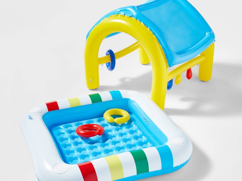 inflatable baby pool and pool top with two ring toys in pool