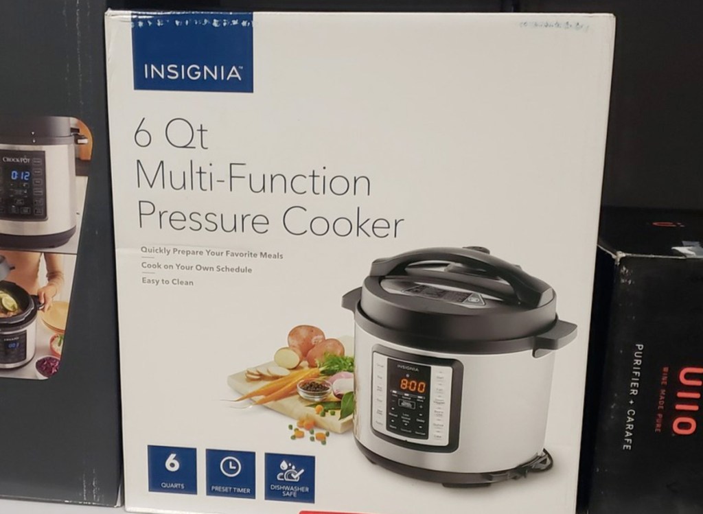 white box for the insignia brand 6-quart multi function pressure cooker on store shelf