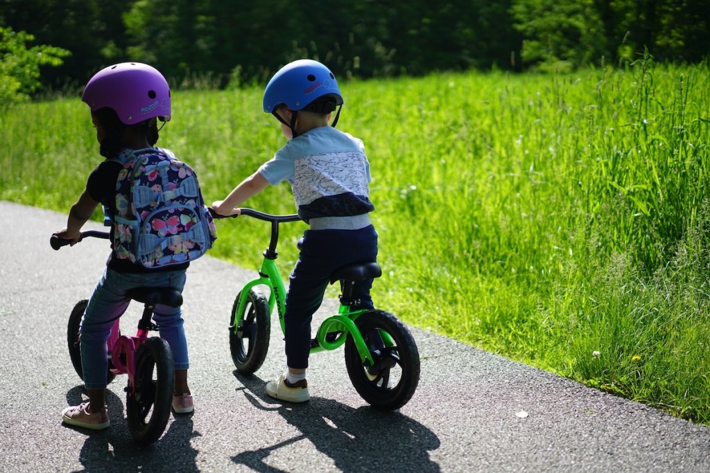 Kids playing on balance bikes