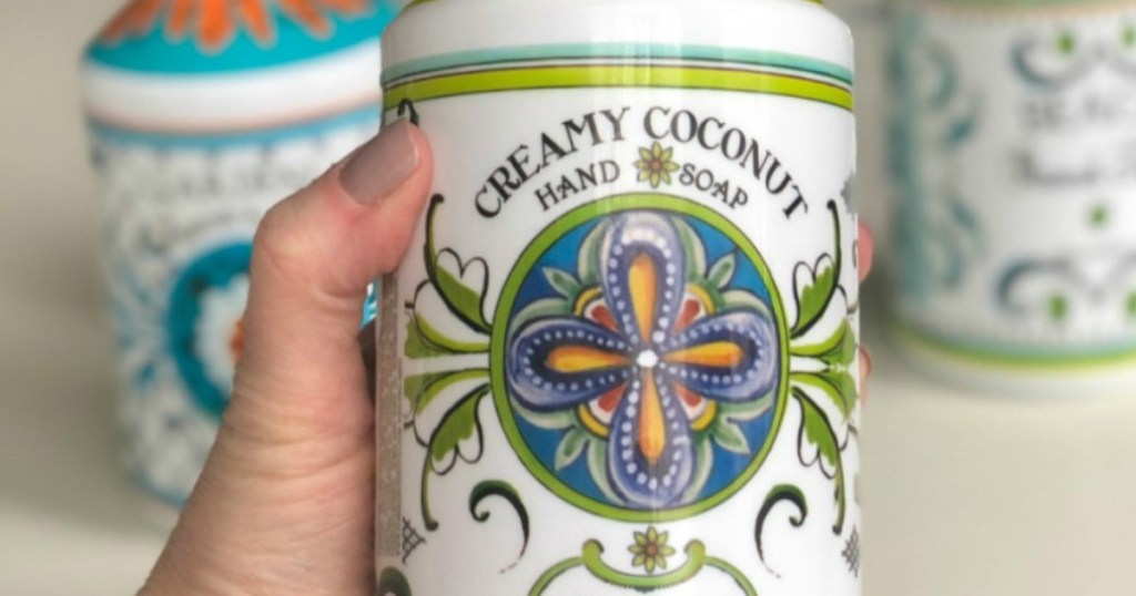 hand holding bottle of soap
