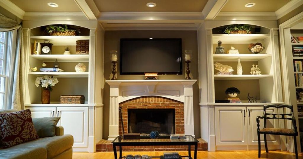 living room with fireplace and mantle with recessed lighting in ceiling 