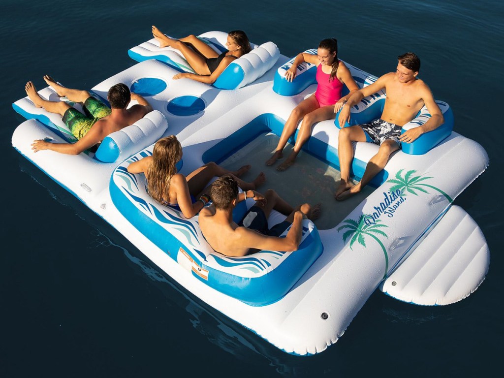 6 people on large raft in water