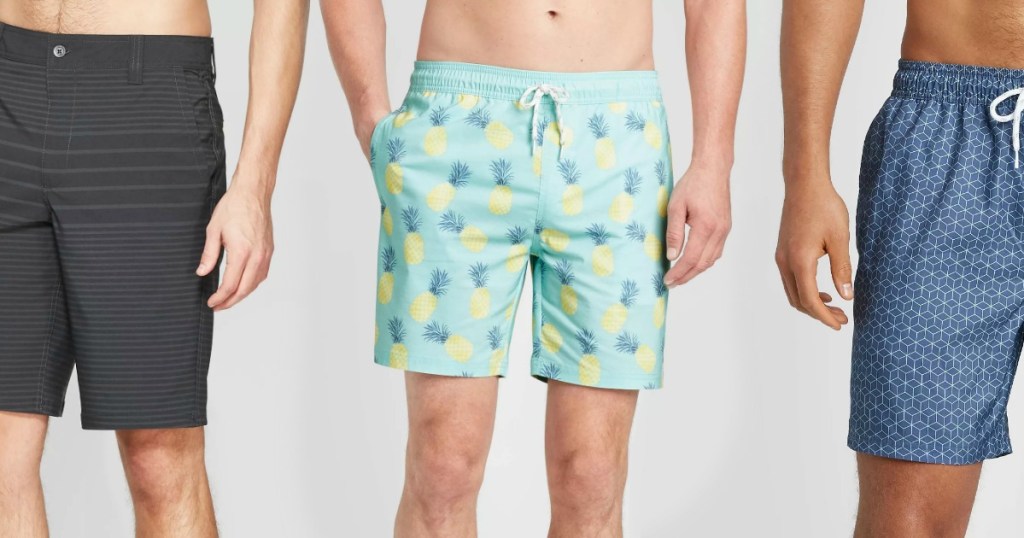 Three men wearing pairs of swim shorts