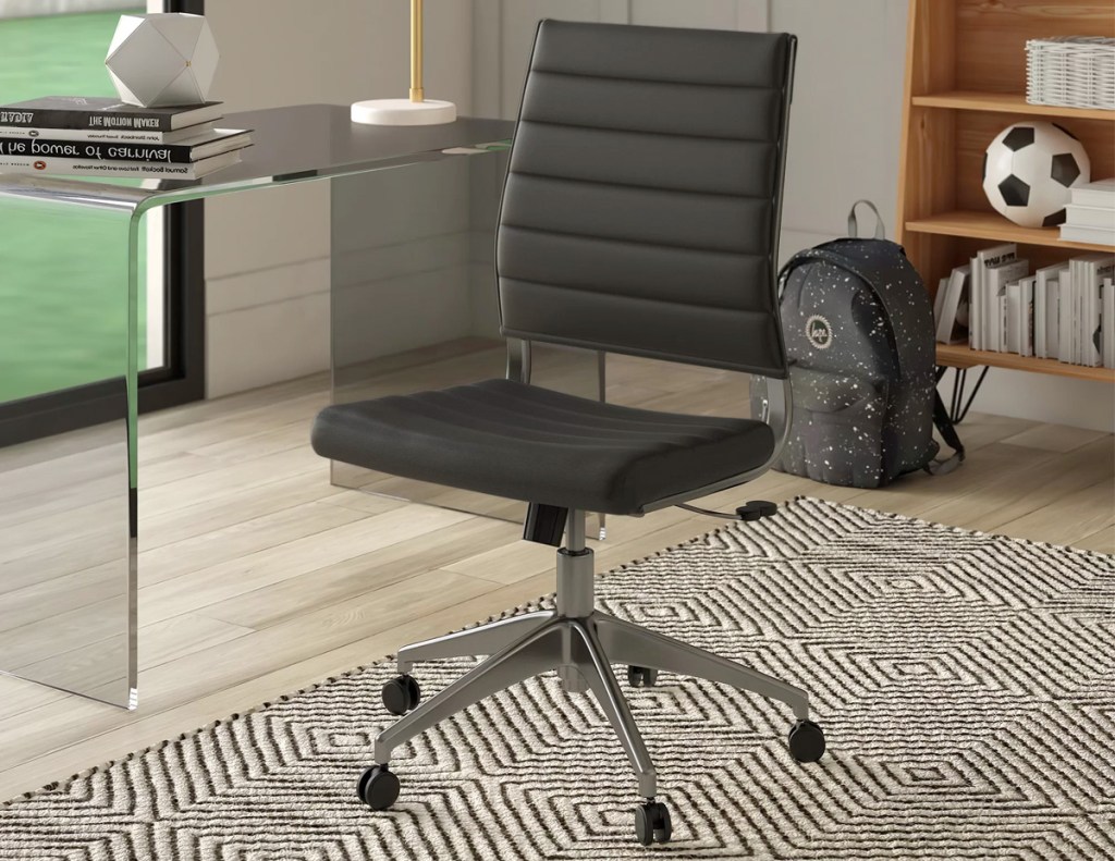 black leather armless office chair in home office