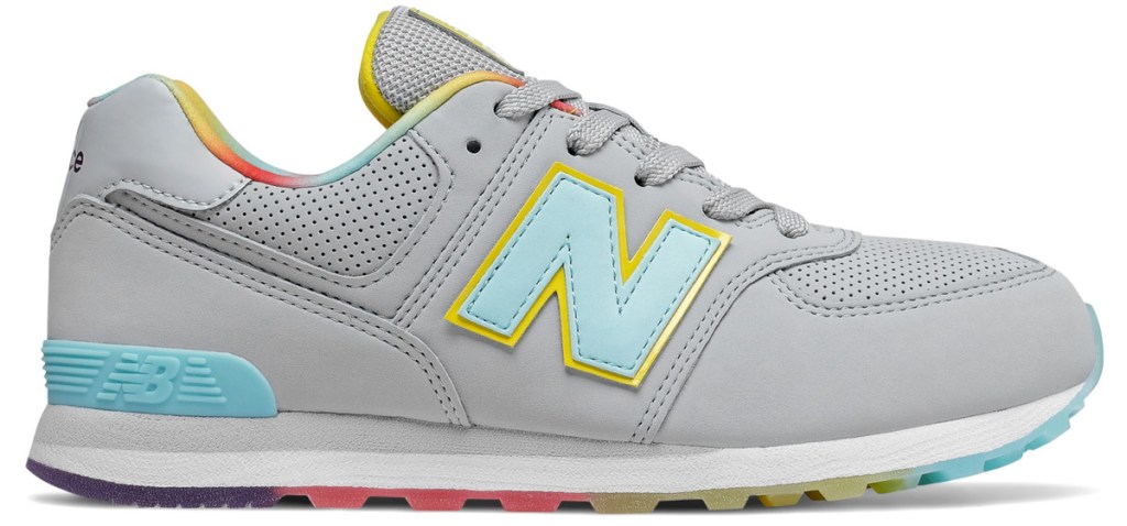 light grey new balance kids shoe with multi color sole