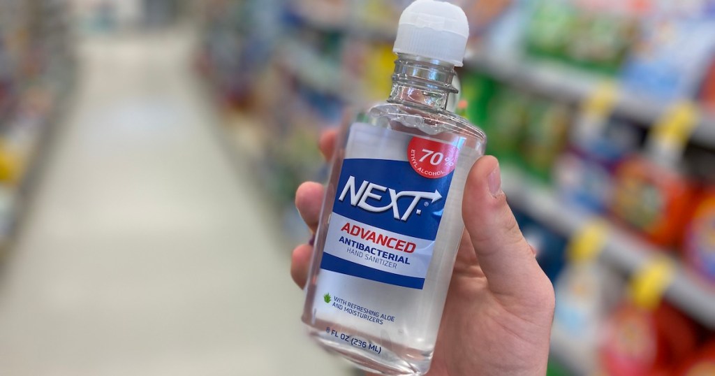 hand holding Next Advanced Antibacterial Gand Sanitizer