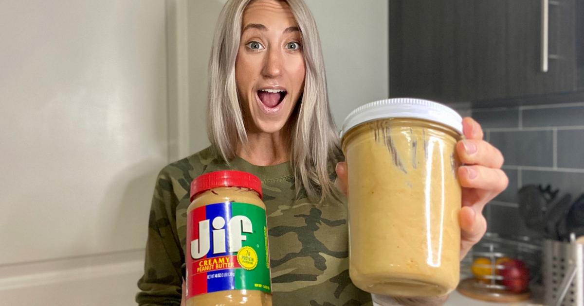 Woman holding a jar of homemade peanut butter in one hand and a tub of Jif in the other hand