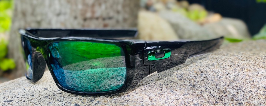 sunglasses sitting on a rock