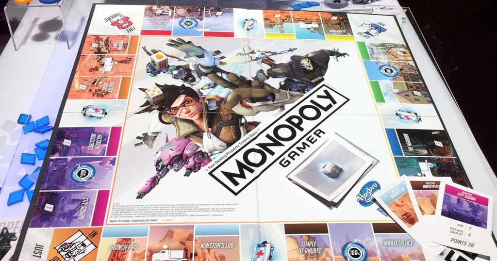 monopoly overwatch edition board game set up with game pieces and cards