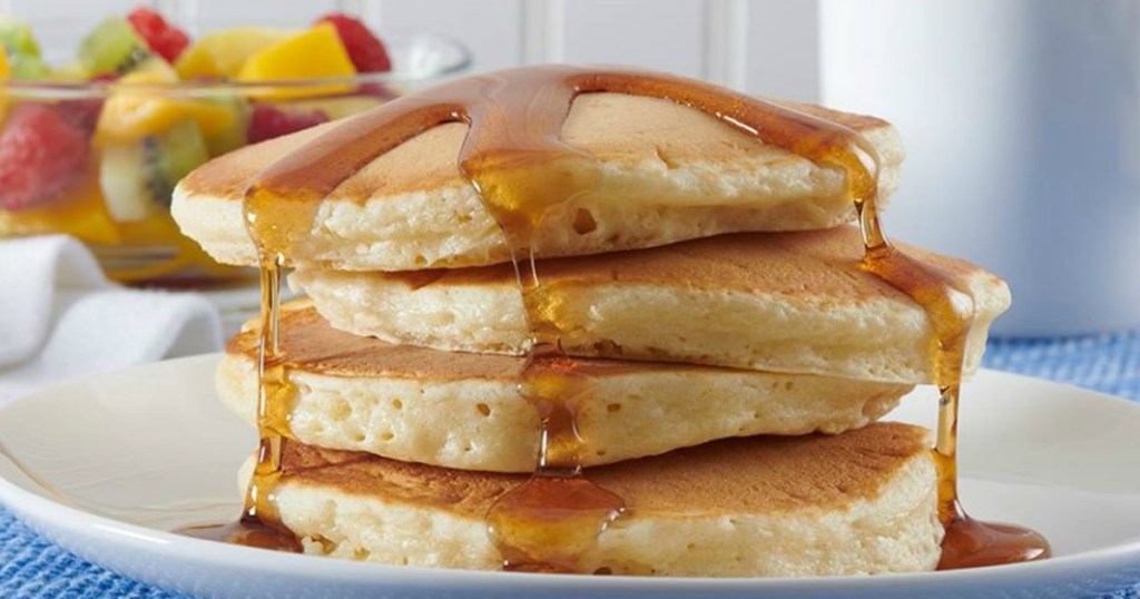 pancakes on a plate with butter and syrup